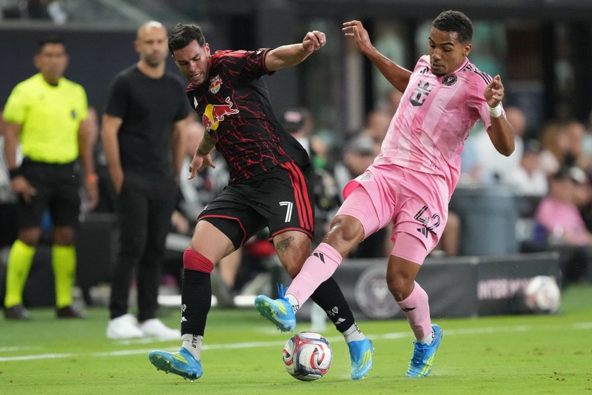 Apr 11, 2026; Miami, Florida, USA;  Red Bull New York forward Cade Cowell (7) fights for possession Inter Miami CF midfielder Yannick Bright (42) during the first half at Miami Freedom Park. Mandatory Credit: Jim Rassol-Imagn Images