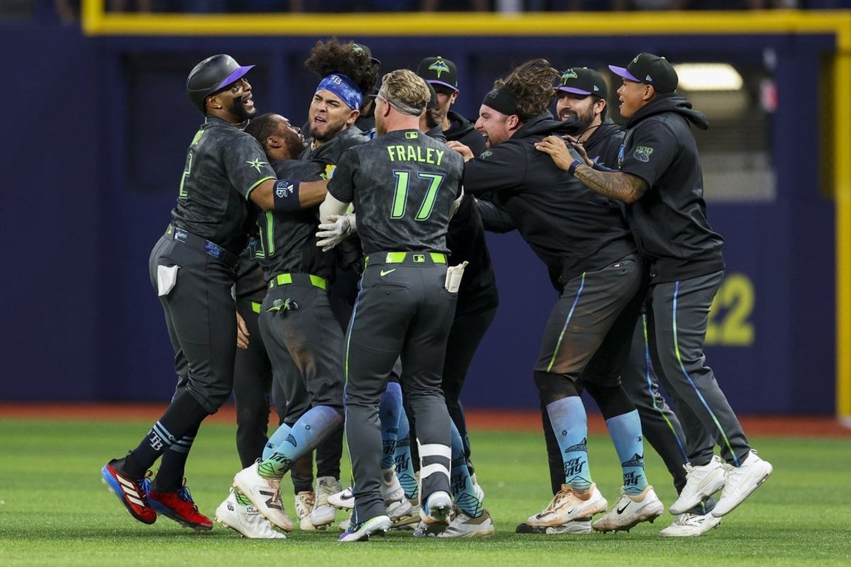 Apr 11, 2026; St. Petersburg, Florida, USA; Tampa Bay Rays first baseman Jonathan Aranda (8) celebrates with center fielder Cedric Mullins (31) and right fielder Jonny DeLuca (21) after beating the New York Yankees in the tenth inning at Tropicana Field. Mandatory Credit: Nathan Ray Seebeck-Imagn Images