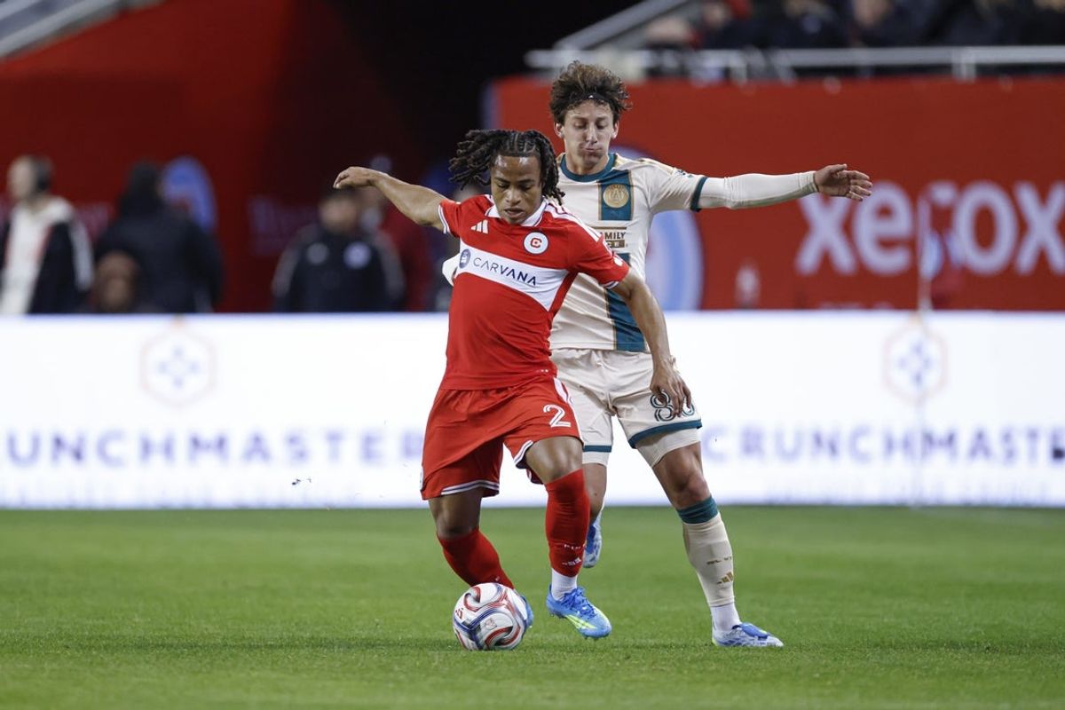 Apr 11, 2026; Chicago, Illinois, USA; Chicago Fire FC defender Leonardo Barroso (2) defends against Atlanta United FC midfielder Matías Galarza (88) during the first half at Soldier Field. Mandatory Credit: Kamil Krzaczynski-Imagn Images