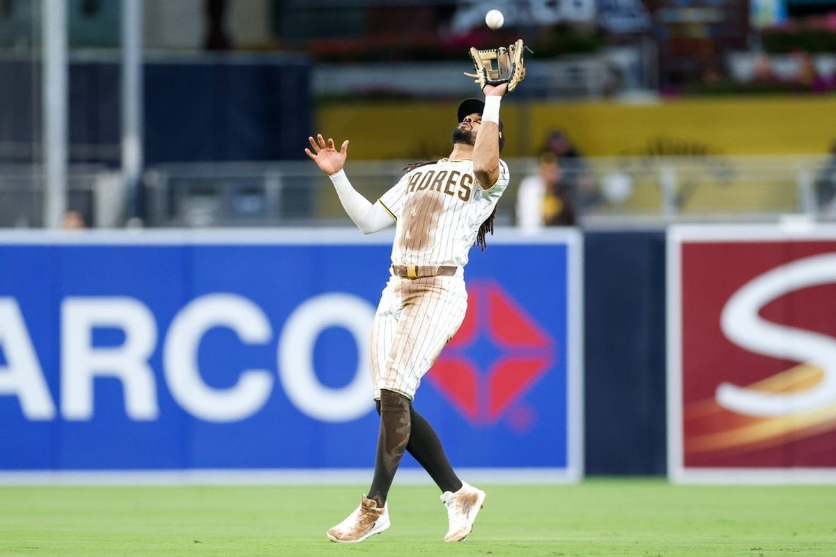 Apr 11, 2026; San Diego, California, USA; San Diego Padres second baseman Fernando Tatis Jr. (23) makes a catch during the fifth inning against the Colorado Rockies at Petco Park. Mandatory Credit: David Frerker-Imagn Images