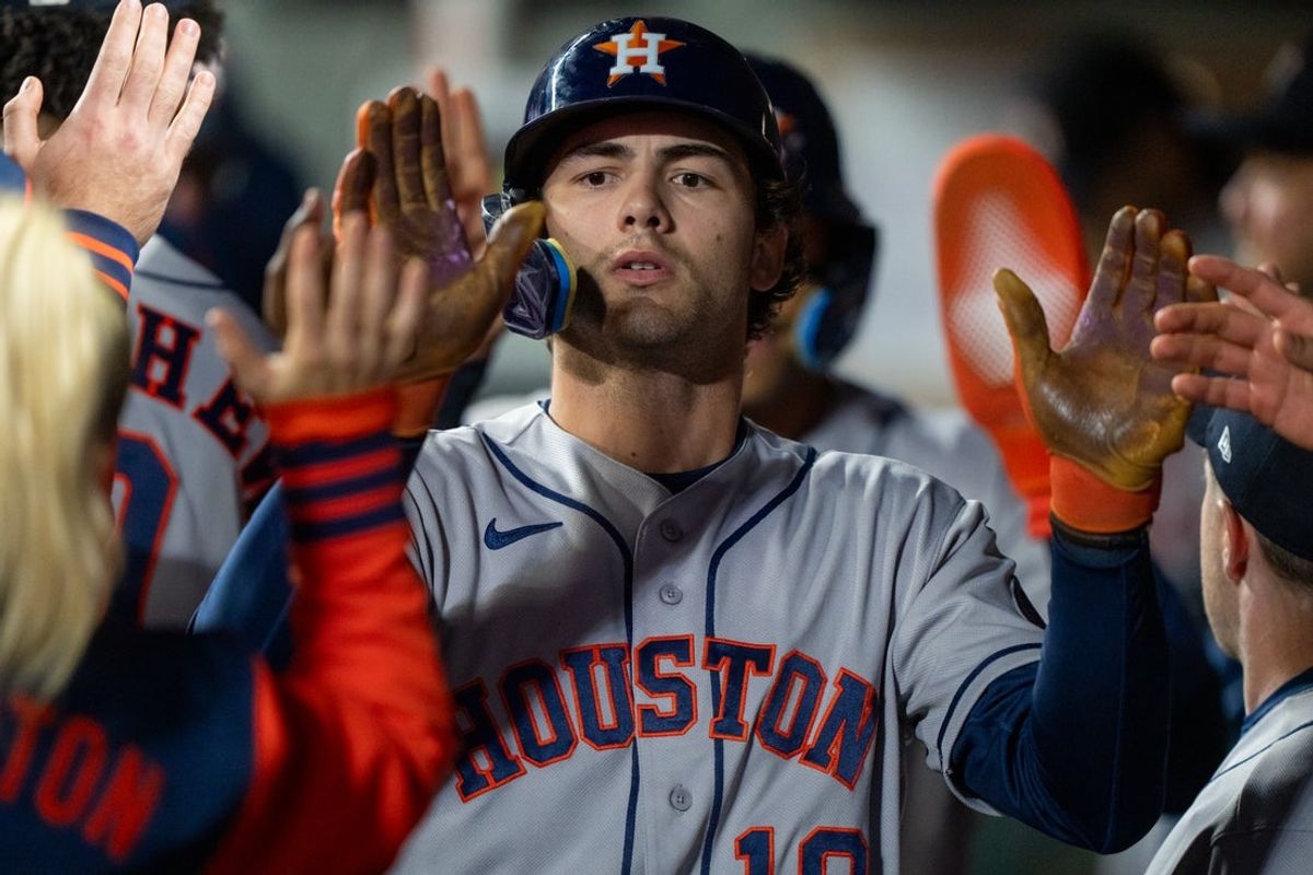 Apr 11, 2026; Seattle, Washington, USA; Houston Astros left fielder Joey Loperfido (10) is congratulated by teammates in the dugout after scoring a run during the second inning against the Seattle Mariners at T-Mobile Park. Mandatory Credit: Stephen Brashear-Imagn Images