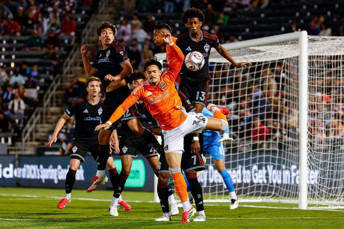 Apr 11, 2026; Commerce City, Colorado, USA; Houston Dynamo FC defender Felipe Andrade (36) battles for the ball with Colorado Rapids midfielder Josh Atencio (12) and midfielder Wayne Frederick (13) in the first half at Dick's Sporting Goods Park. Mandatory Credit: Isaiah J. Downing-Imagn Images