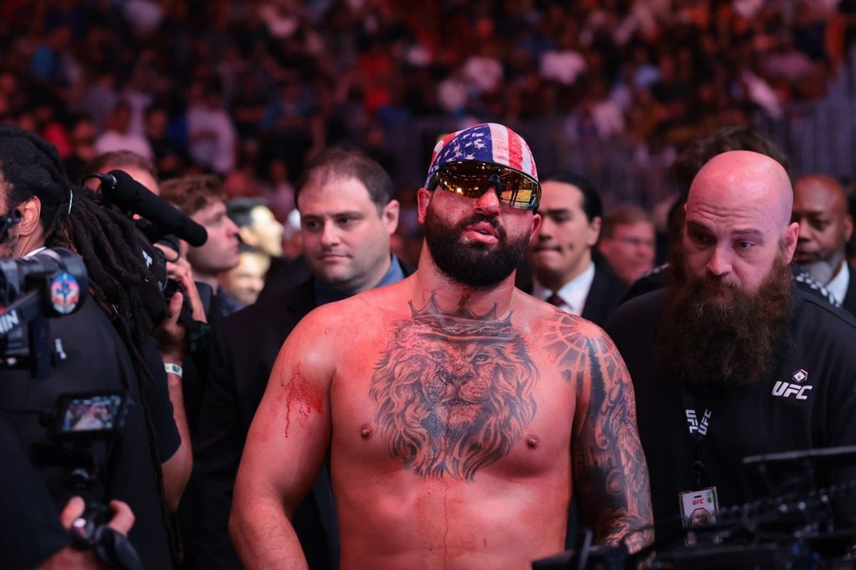 Apr 11, 2026; Miami, Florida, UNITED STATES; Josh Hokit (blue gloves) reacts after the fight against Curtis Blaydes (red gloves) during UFC 327 at Kaseya Center. Mandatory Credit: Sam Navarro-Imagn Images