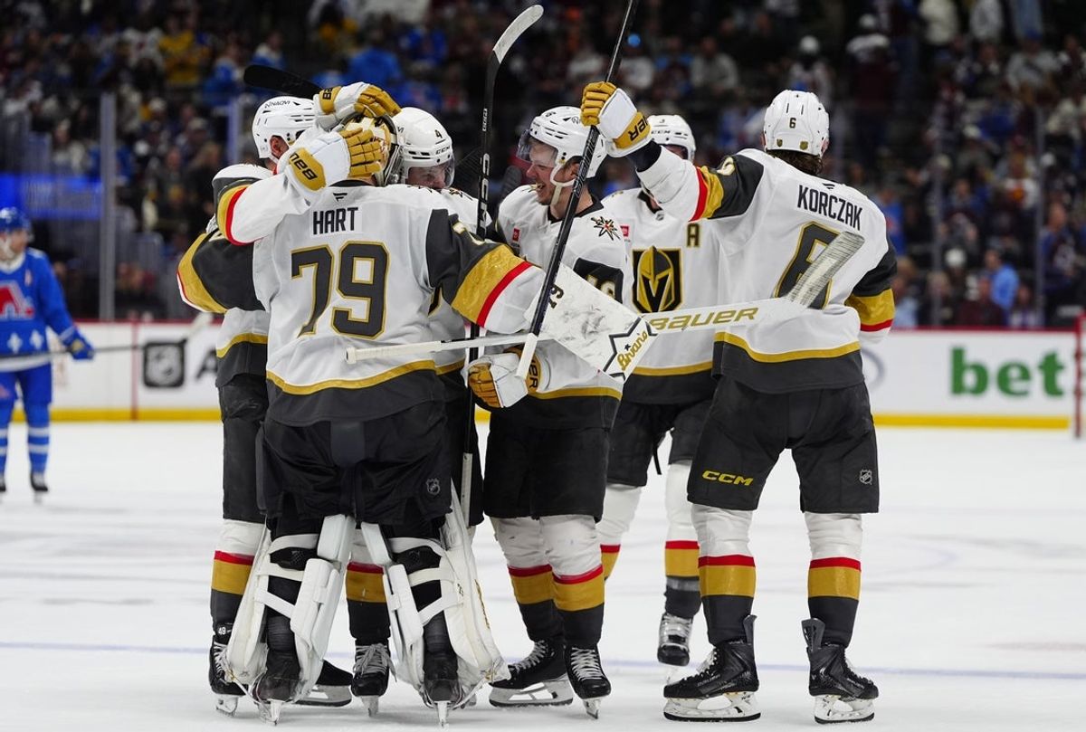 Apr 11, 2026; Denver, Colorado, USA; Members of the Vegas Golden Knights celebrate an overtime win against the Colorado Avalanche at Ball Arena. Mandatory Credit: Ron Chenoy-Imagn Images