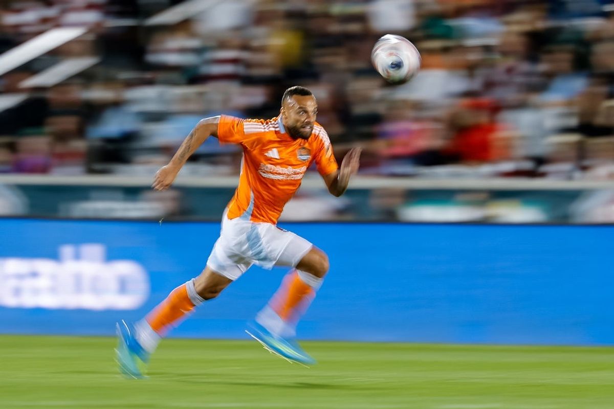 Apr 11, 2026; Commerce City, Colorado, USA; Houston Dynamo FC midfielder Guilherme (20) chases down a loose ball in the first half against the Colorado Rapids at Dick's Sporting Goods Park. Mandatory Credit: Isaiah J. Downing-Imagn Images