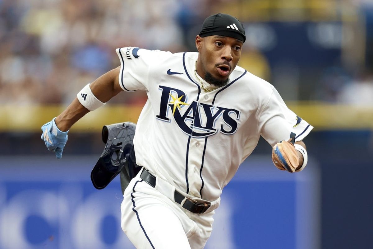 Apr 12, 2026; St. Petersburg, Florida, USA; Tampa Bay Rays left fielder Chandler Simpson (14) runs to third base against the New York Yankees in the first inning at Tropicana Field. Mandatory Credit: Nathan Ray Seebeck-Imagn Images