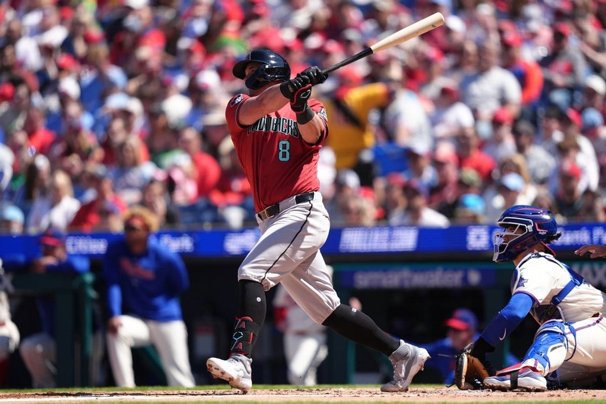 Apr 12, 2026; Philadelphia, Pennsylvania, USA; Arizona Diamondbacks catcher James McCann (8) hits an RBI double against the Philadelphia Phillies in the second inning at Citizens Bank Park. Mandatory Credit: Kyle Ross-Imagn Images