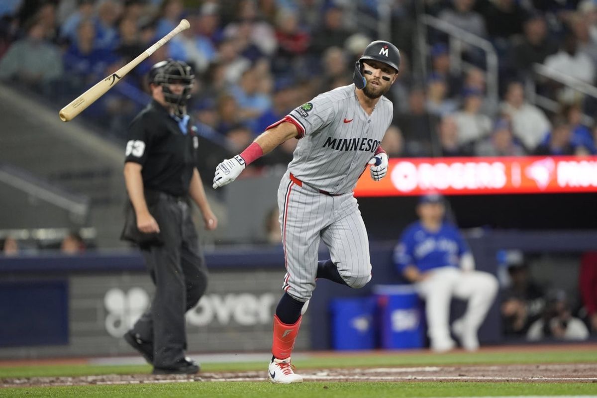 Apr 12, 2026; Toronto, Ontario, CAN; Minnesota Twins first baseman Kody Clemens (2) throws his bat after hitting a solo home run against the Toronto Blue Jays during the third inning at Rogers Centre. Mandatory Credit: John E. Sokolowski-Imagn Images