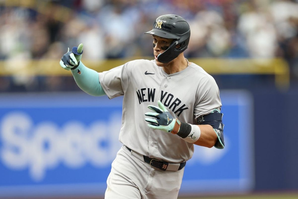 Apr 12, 2026; St. Petersburg, Florida, USA; New York Yankees designated hitter Aaron Judge (99) reacts after hitting a two-run home run against the Tampa Bay Rays in the ninth inning at Tropicana Field. Mandatory Credit: Nathan Ray Seebeck-Imagn Images