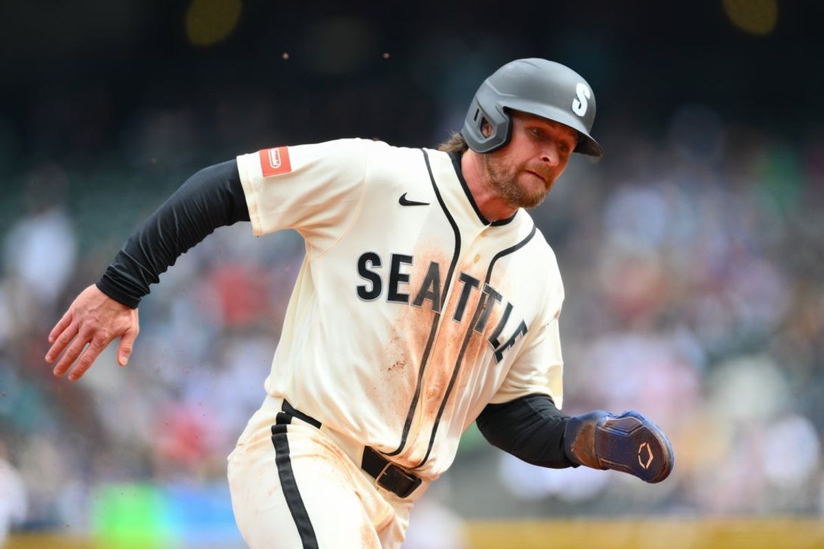 Apr 12, 2026; Seattle, Washington, USA; Seattle Mariners third baseman Brendan Donovan (33) runs towards home plate to score a run against the Houston Astros during the first inning at T-Mobile Park. Mandatory Credit: Steven Bisig-Imagn Images