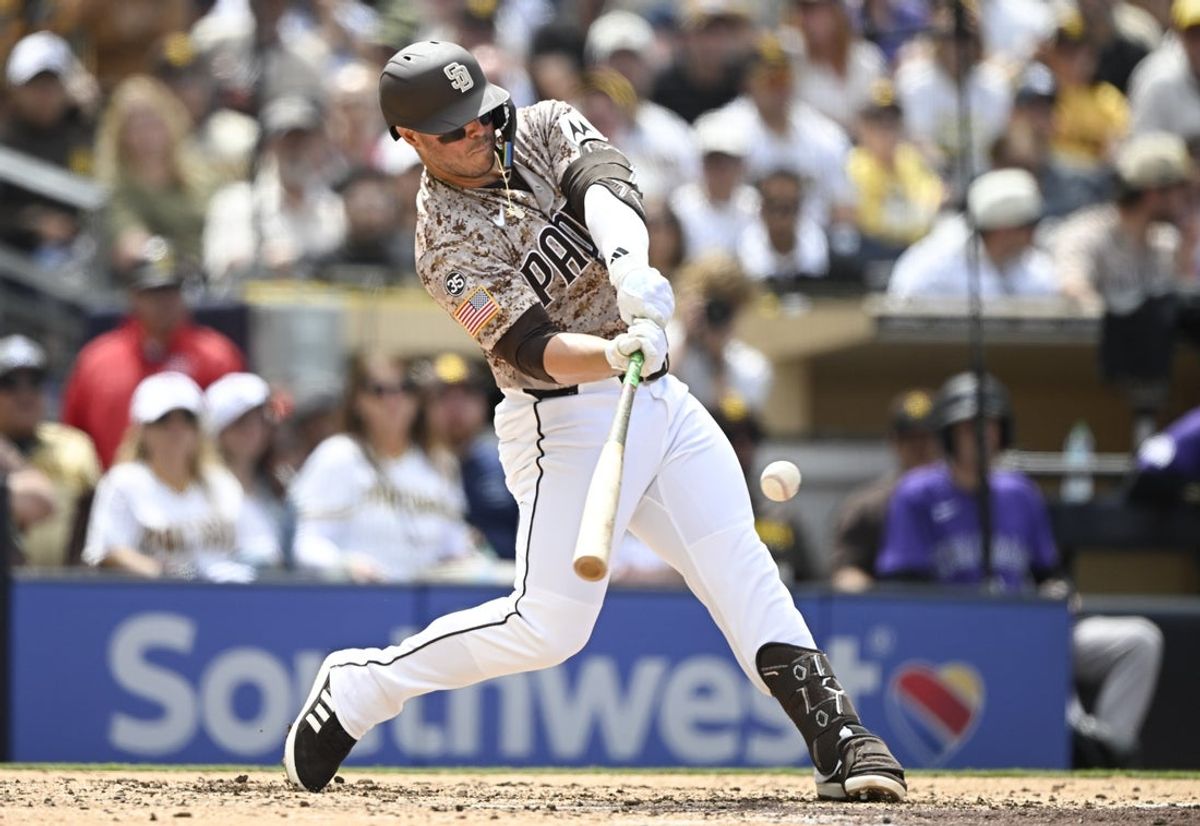 Apr 12, 2026; San Diego, California, USA; San Diego Padres first baseman Ty France (25) hits a solo home run during the fourth inning against the Colorado Rockies at Petco Park. Mandatory Credit: Denis Poroy-Imagn Images