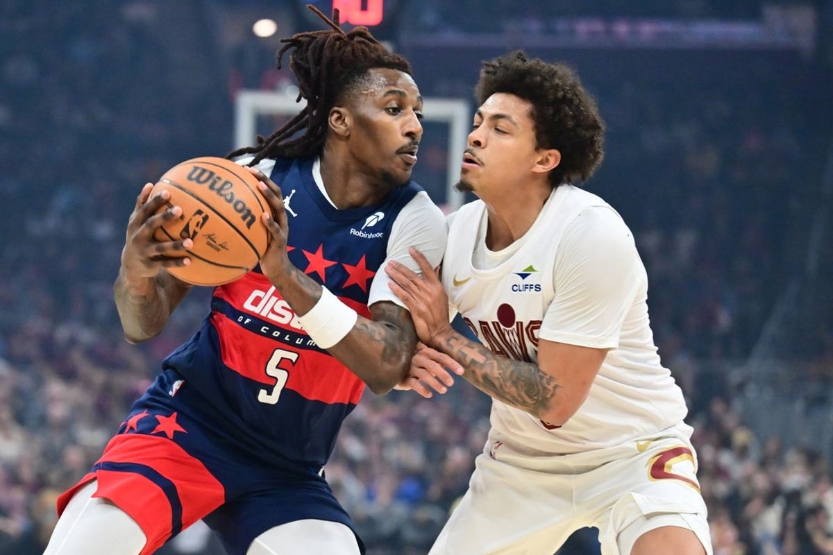 Apr 12, 2026; Cleveland, Ohio, USA; Washington Wizards guard Jamir Watkins (5) drives to the basket against Cleveland Cavaliers guard Craig Porter Jr. (9) during the first quarter at Rocket Arena. Mandatory Credit: Ken Blaze-Imagn Images