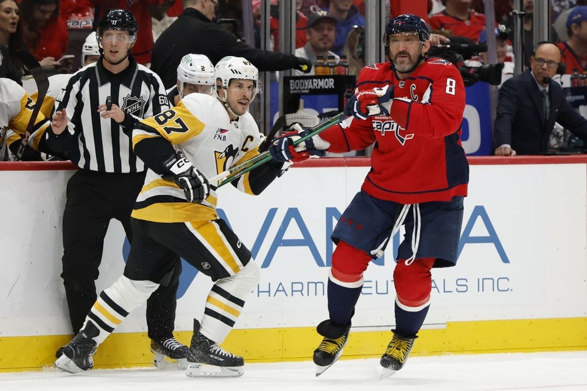 Apr 12, 2026; Washington, District of Columbia, USA; Washington Capitals left wing Alex Ovechkin (8) covers Pittsburgh Penguins center Sidney Crosby (87) in the final minute during the third period at Capital One Arena. Mandatory Credit: Geoff Burke-Imagn Images