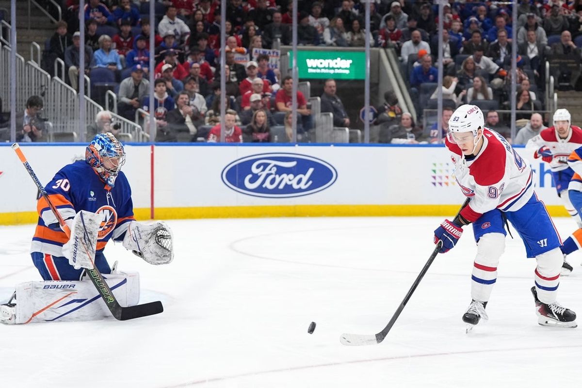 Apr 12, 2026; Elmont, New York, USA; Montréal Canadiens right wing Ivan Demidov (93) tips a shot towards New York Islanders goaltender Ilya Sorokin (30) in the first period at UBS Arena. Mandatory Credit: Alexander Wohl-Imagn Images