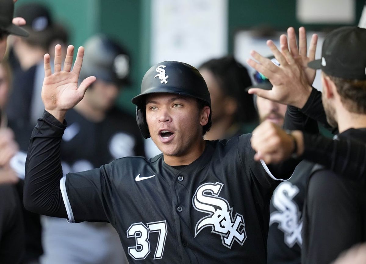 Apr 12, 2026; Kansas City, Missouri, USA; Chicago White Sox left fielder Dustin Harris (37) is congratulated by teammates after scoring a run during the seventh inning against the Kansas City Royals at Kauffman Stadium. Mandatory Credit: Jay Biggerstaff-Imagn Images