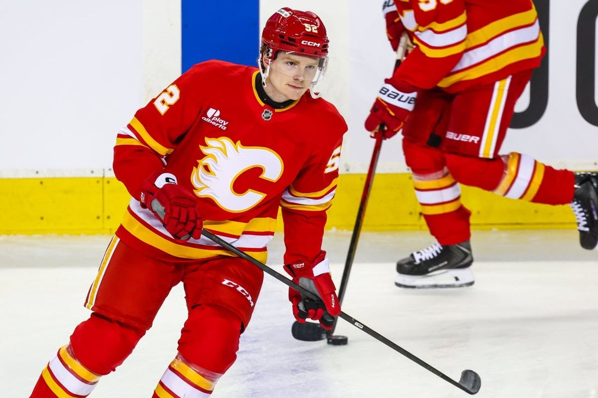 Apr 12, 2026; Calgary, Alberta, CAN; Calgary Flames defenseman Abram Wiebe (52) skates during the warmup period against the Utah Mammoth at Scotiabank Saddledome. Mandatory Credit: Sergei Belski-Imagn Images