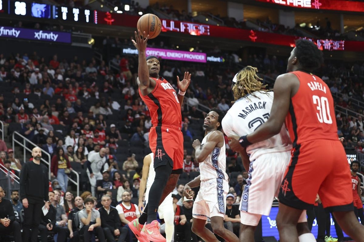 Apr 12, 2026; Houston, Texas, USA; Houston Rockets forward Jae'sean Tate (8) attempts to get control of a loose ball during the second quarter against the Memphis Grizzlies at Toyota Center. Mandatory Credit: Troy Taormina-Imagn Images