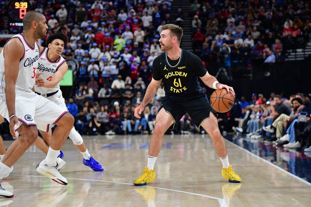 Apr 12, 2026; Inglewood, California, USA; Golden State Warriors guard Pat Spencer (61) controls the ball against Los Angeles Clippers forward Nicolas Batum (33) and guard Kobe Sanders (4) during the first half at Intuit Dome. Mandatory Credit: Gary A. Vasquez-Imagn Images