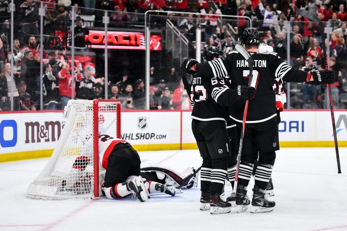 Apr 12, 2026; Newark, New Jersey, USA; New Jersey Devils center Nico Hischier (13) celebrates with teammates after scoring the game-winning goal in overtime against the Ottawa Senators at Prudential Center. Mandatory Credit: John Jones-Imagn Images