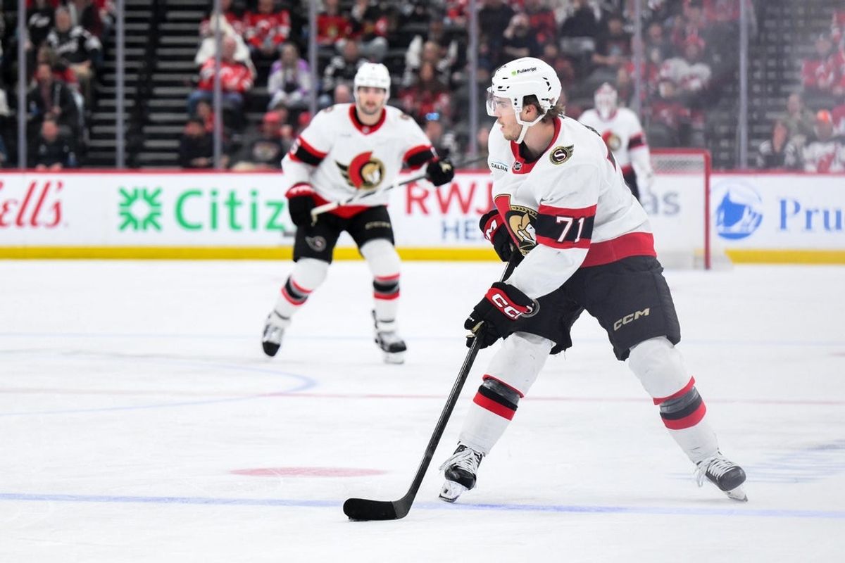 Apr 12, 2026; Newark, New Jersey, USA; Ottawa Senators center Ridly Greig (71) controls the puck against the New Jersey Devils during the third period at Prudential Center. Mandatory Credit: John Jones-Imagn Images
