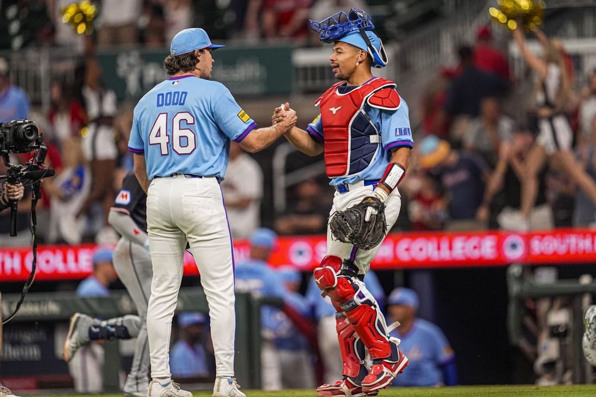 Apr 12, 2026; Cumberland, Georgia, USA; Atlanta Braves pitcher Dylan Dodd (46) reacts with catcher Drake Baldwin (30) after defeating the Cleveland Guardians at Truist Park. Mandatory Credit: Dale Zanine-Imagn Images