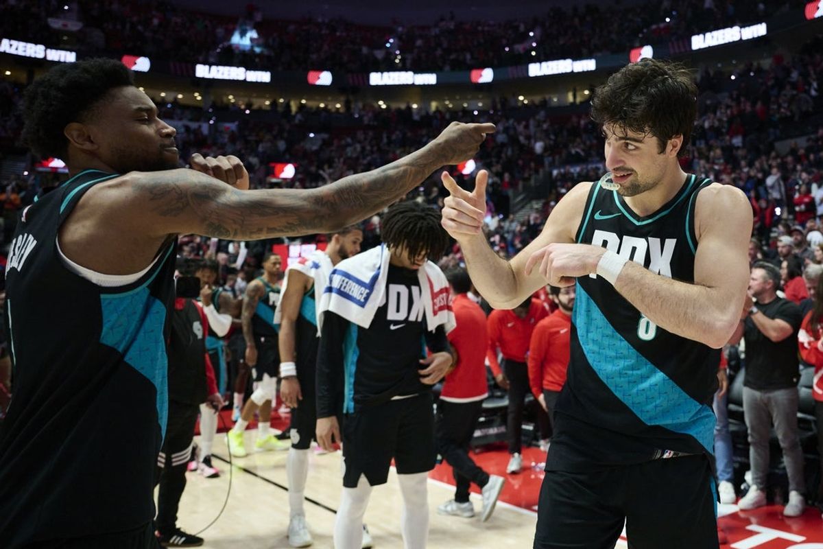 Apr 12, 2026; Portland, Oregon, USA; Portland Trail Blazers guard Blake Wesley (1), left, and forward Deni Avdija (8) celebrate after a game against the Sacramento Kings at Moda Center. Mandatory Credit: Troy Wayrynen-Imagn Images