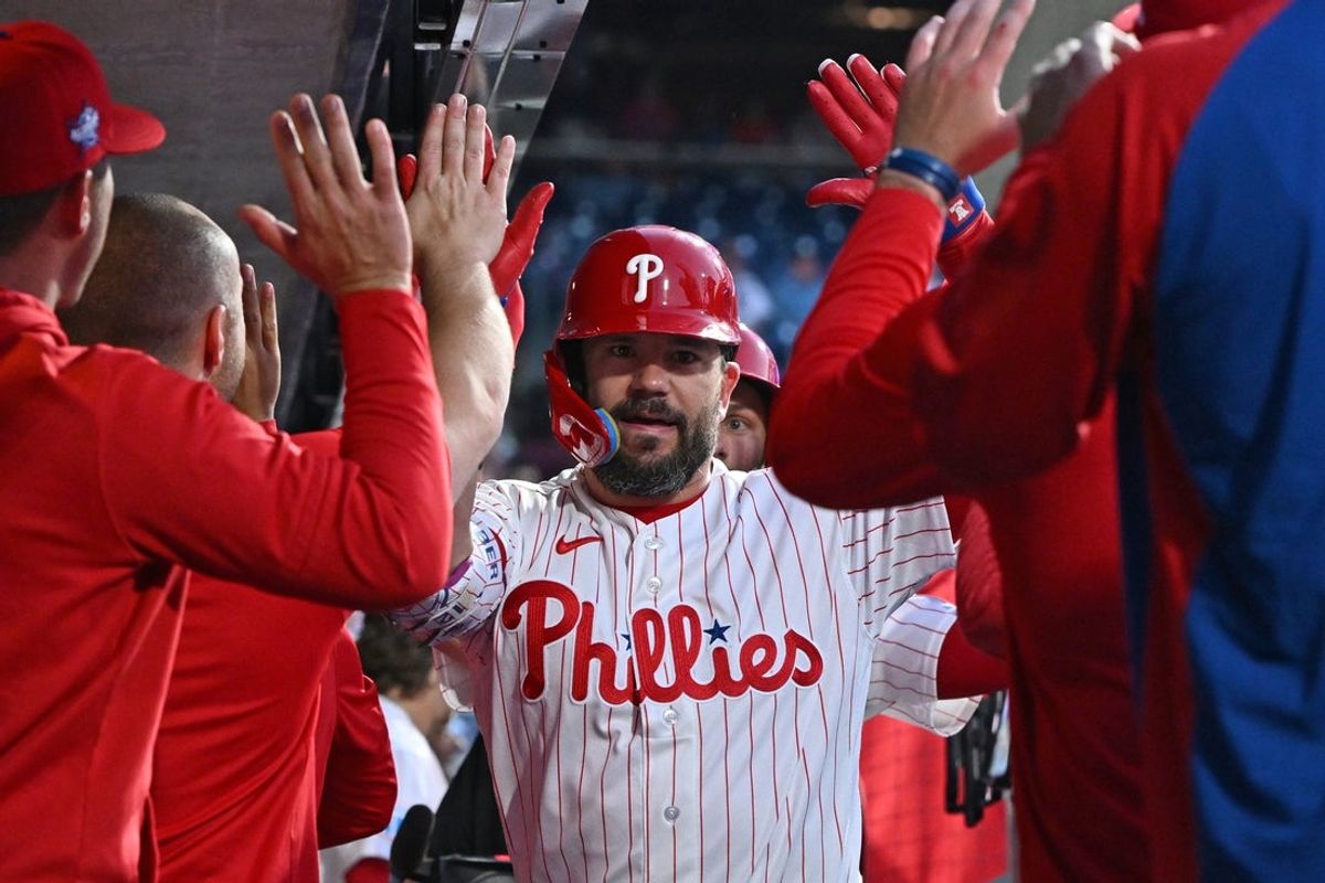 Apr 13, 2026; Philadelphia, Pennsylvania, USA; Philadelphia Phillies left fielder Kyle Schwarber (12) celebrates his home run in the dugout with teammates against the Chicago Cubs during the third inning at Citizens Bank Park. Mandatory Credit: Eric Hartline-Imagn Images