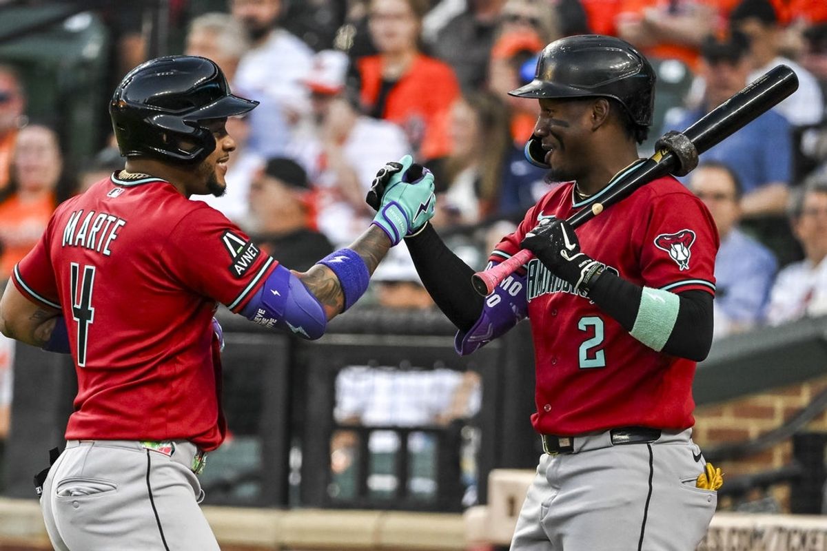 Apr 13, 2026; Baltimore, Maryland, USA;  Arizona Diamondbacks second baseman Ketel Marte (4) celebrates with  shortstop Geraldo Perdomo (2) after hitting a solo home run in the third inning against the Baltimore Orioles at Oriole Park at Camden Yards. Mandatory Credit: Tommy Gilligan-Imagn Images