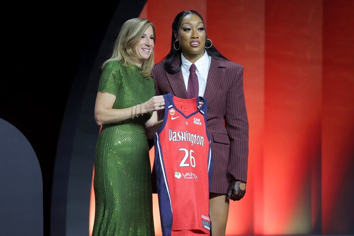 Apr 13, 2026; New York, NY, USA;  WNBA Commissioner Cathy Engelbert (left) poses for photos with Cotie McMahon who was selected eleventh overall by the Washington Mystics during the 2026 WNBA Draft at The Shed at Hudson Yards. Mandatory Credit: Brad Penner-Imagn Images