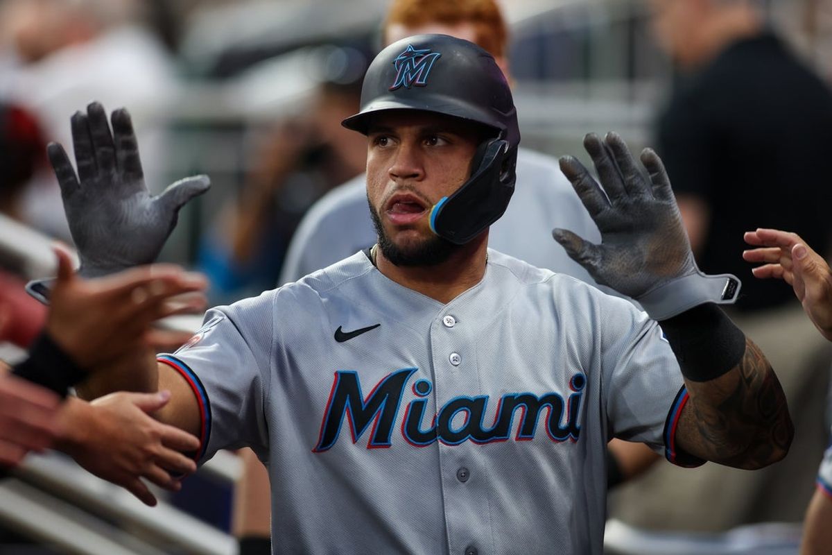 Apr 13, 2026; Atlanta, Georgia, USA; Miami Marlins designated hitter Agustin Ramirez (50) celebrates with teammates after scoring a run against the Atlanta Braves in the fourth inning at Truist Park. Mandatory Credit: Brett Davis-Imagn Images