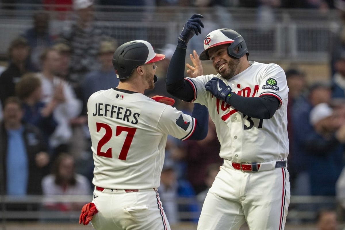 Apr 13, 2026; Minneapolis, Minnesota, USA; Minnesota Twins first baseman Victor Caratini (37) celebrates with  catcher Ryan Jeffers (27) after hitting a home run against the Boston Red Sox in the second inning at Target Field. Mandatory Credit: Jesse Johnson-Imagn Images
