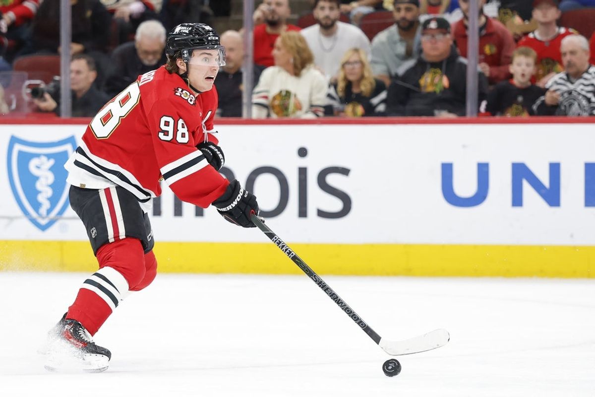 Apr 13, 2026; Chicago, Illinois, USA; Chicago Blackhawks center Connor Bedard (98) looks to pass the puck against the Buffalo Sabres during the first period at United Center. Mandatory Credit: Kamil Krzaczynski-Imagn Images