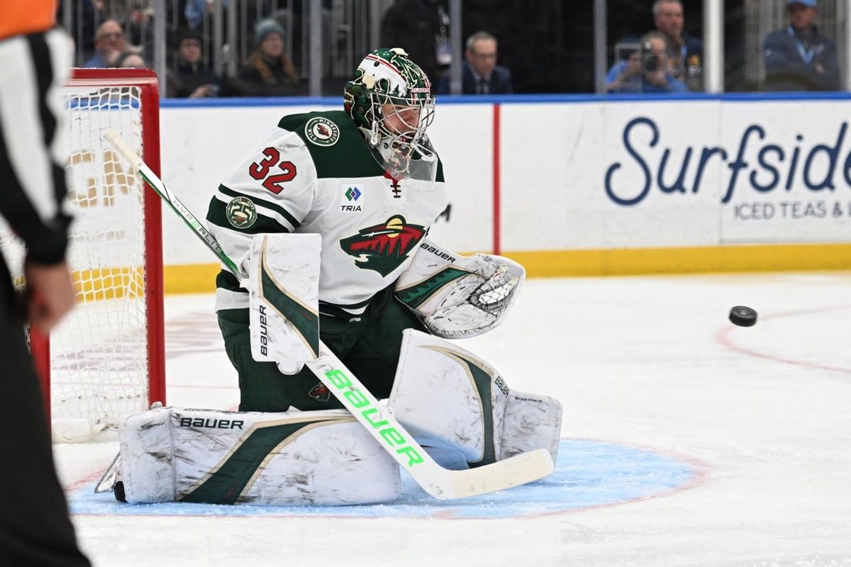 Apr 13, 2026; St. Louis, Missouri, USA; Minnesota Wild goaltender Filip Gustavsson (32) blocks a shot from the St. Louis Blues in the second period at Enterprise Center. Mandatory Credit: Joe Puetz-Imagn Images