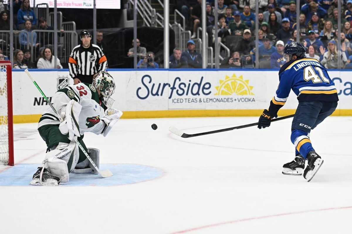Apr 13, 2026; St. Louis, Missouri, USA; St. Louis Blues defenseman Theo Lindstein (41) scores a goal past Minnesota Wild goaltender Filip Gustavsson (32) in the second period at Enterprise Center. Mandatory Credit: Joe Puetz-Imagn Images