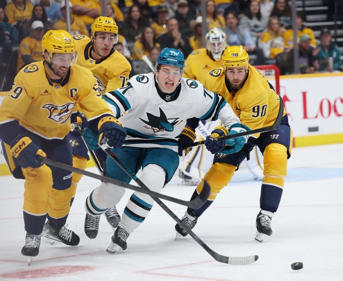 Apr 13, 2026; Nashville, Tennessee, USA; San Jose Sharks center Macklin Celebrini (71) competes for the puck against Nashville Predators defenseman Roman Josi (59) and center Ryan O'Reilly (90) during the third period of their game at Bridgestone Arena. Mandatory Credit: Alan Poizner-Imagn Images