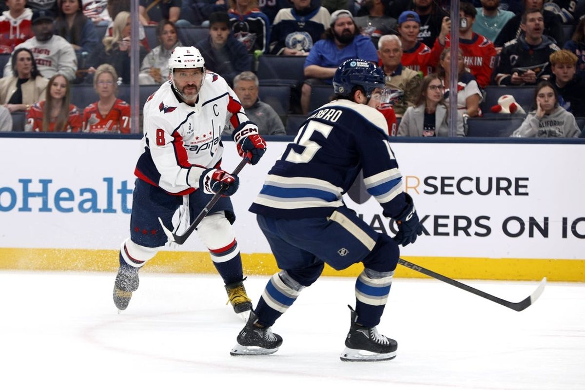 Apr 14, 2026; Columbus, Ohio, USA; Washington Capitals left wing Alex Ovechkin (8) follows through on a shot as Columbus Blue Jackets defenseman Dante Fabbro (15) defends during the first period at Nationwide Arena. Mandatory Credit: Russell LaBounty-Imagn Images