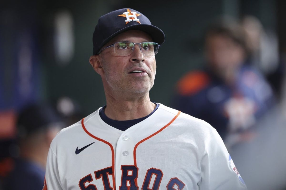Apr 14, 2026; Houston, Texas, USA; Houston Astros manager Joe Espada looks on from the dugout before the game against the Colorado Rockies at Daikin Park. Mandatory Credit: Troy Taormina-Imagn Images