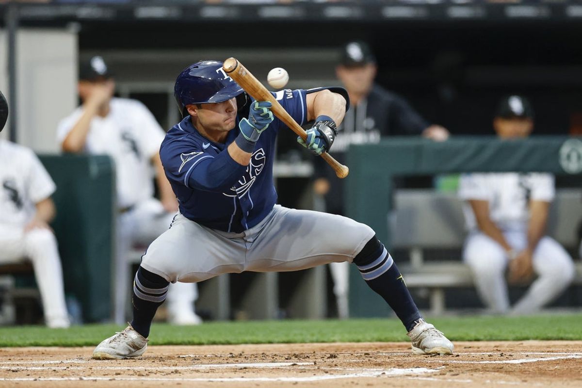 Apr 14, 2026; Chicago, Illinois, USA; Tampa Bay Rays second baseman Ben Williamson (15) hits a two-run sacrifice bunt against the Chicago White Sox during the first inning at Rate Field. Mandatory Credit: Kamil Krzaczynski-Imagn Images