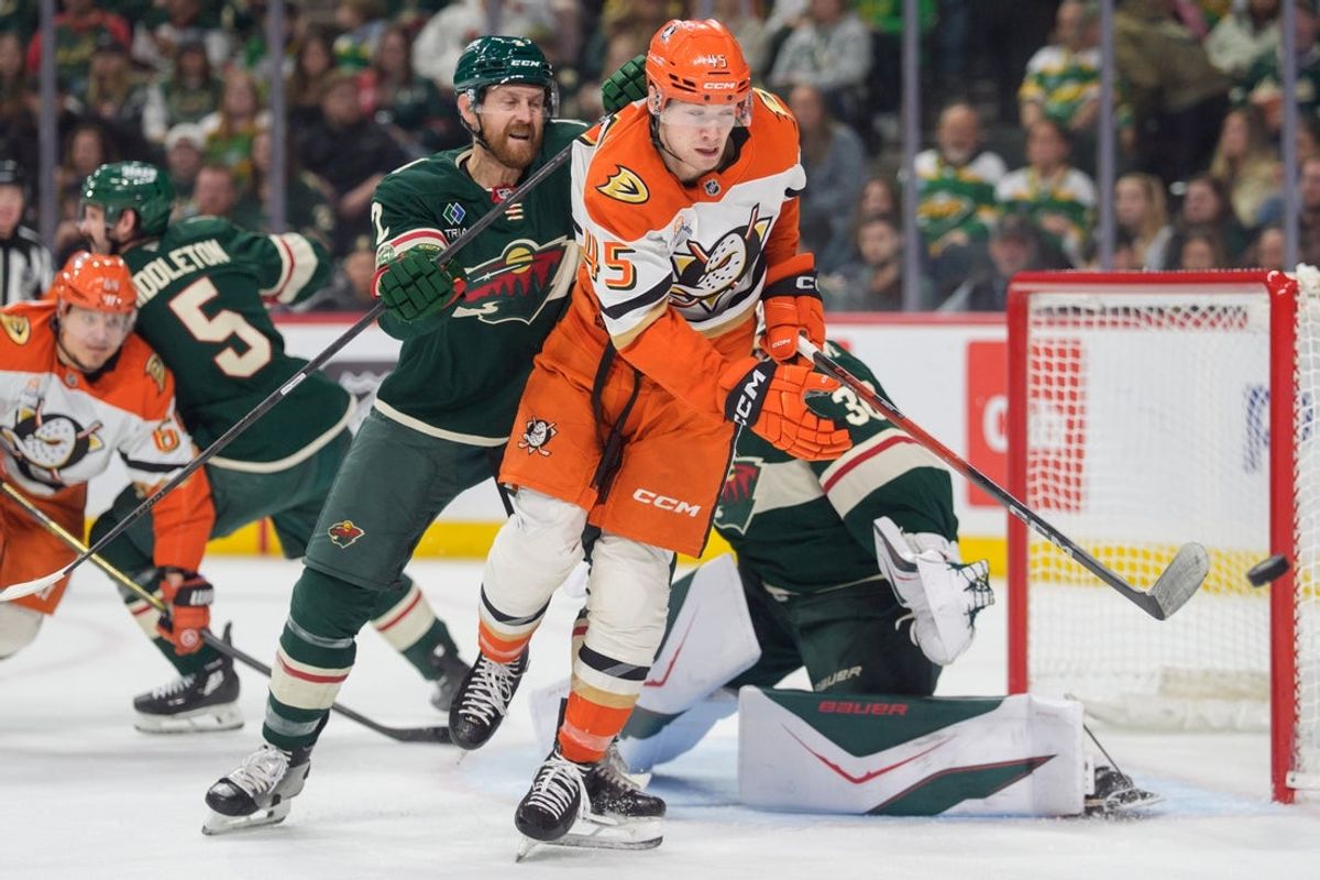 Apr 14, 2026; Saint Paul, Minnesota, USA; Anaheim Ducks right wing Beckett Sennecke (45) is pushed out of the crease by Minnesota Wild defenseman Jeff Petry (2) in the first period at Grand Casino Arena. Mandatory Credit: Matt Blewett-Imagn Images