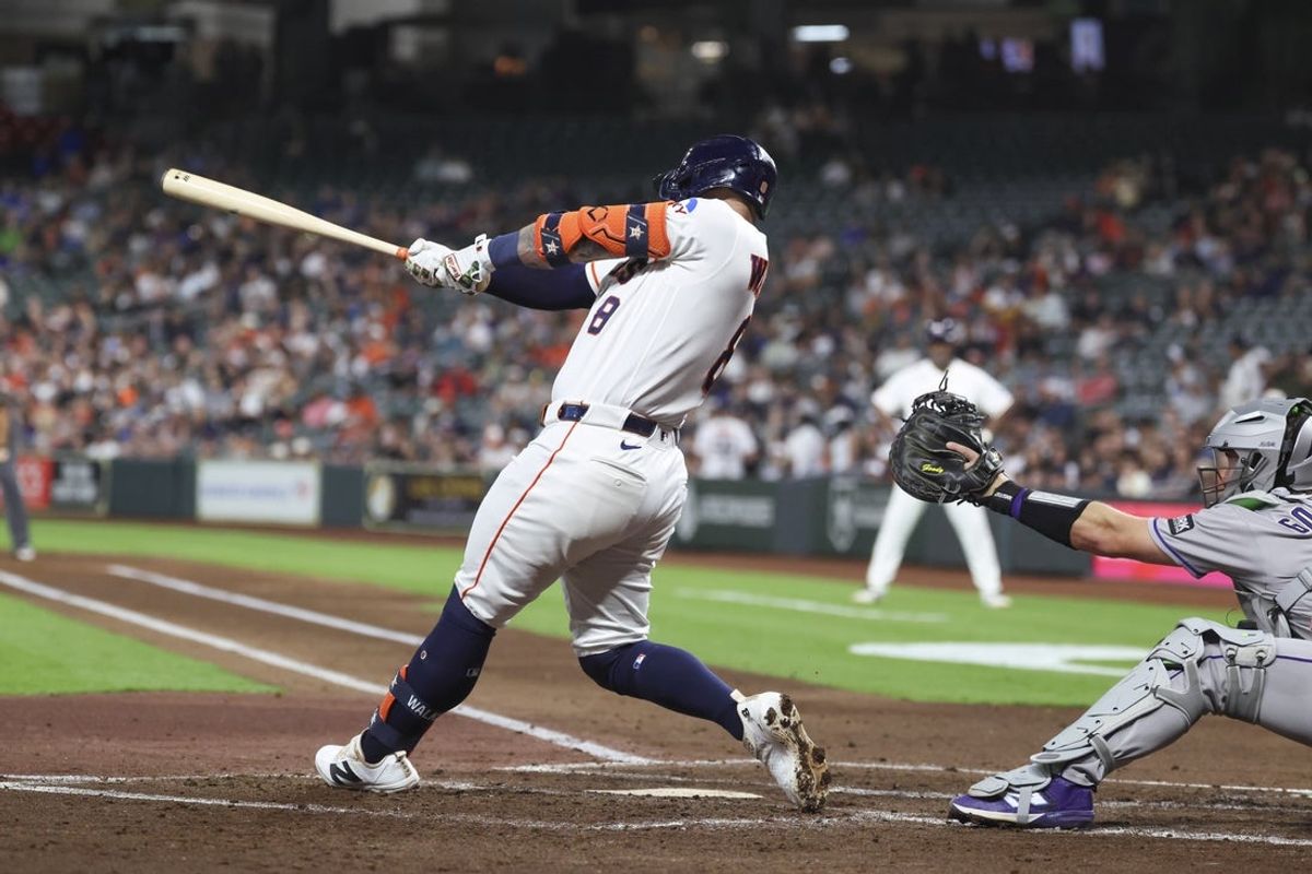 Apr 14, 2026; Houston, Texas, USA; Houston Astros first baseman Christian Walker (8) hits a home run during the second inning against the Colorado Rockies at Daikin Park. Mandatory Credit: Troy Taormina-Imagn Images