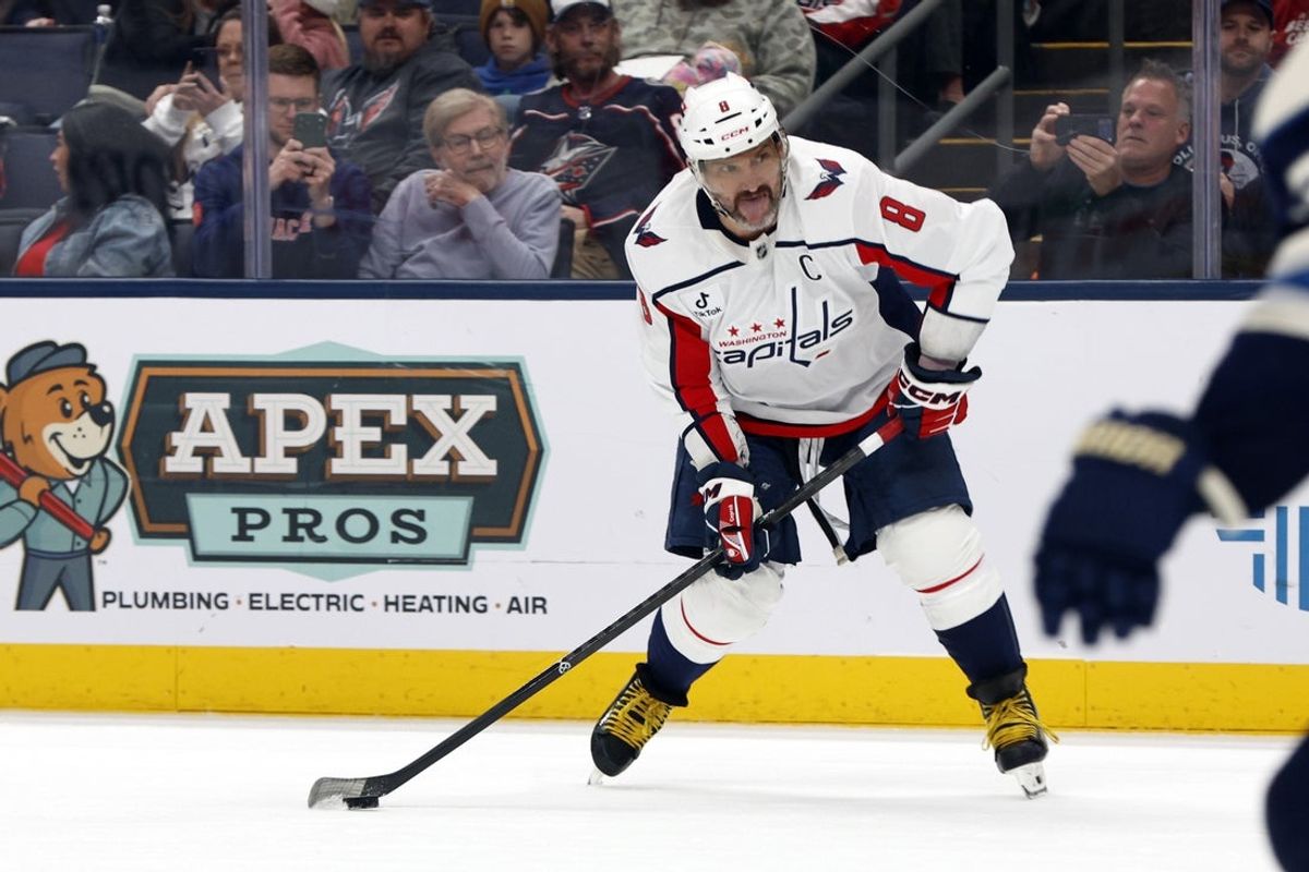 Washington Capitals left wing Alex Ovechkin (8) wrists a shot on goal against the Columbus Blue Jackets during the third period at Nationwide Arena. Mandatory Credit: Russell LaBounty-Imagn Images