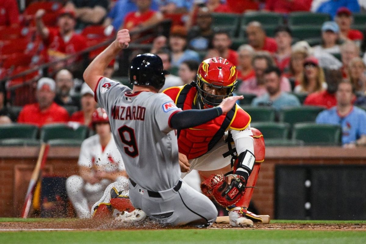 Apr 14, 2026; St. Louis, Missouri, USA; St. Louis Cardinals catcher Iván Herrera (48) tags out Cleveland Guardians first baseman Kyle Manzardo (9) during the fourth inning at Busch Stadium. Mandatory Credit: Jeff Curry-Imagn Images