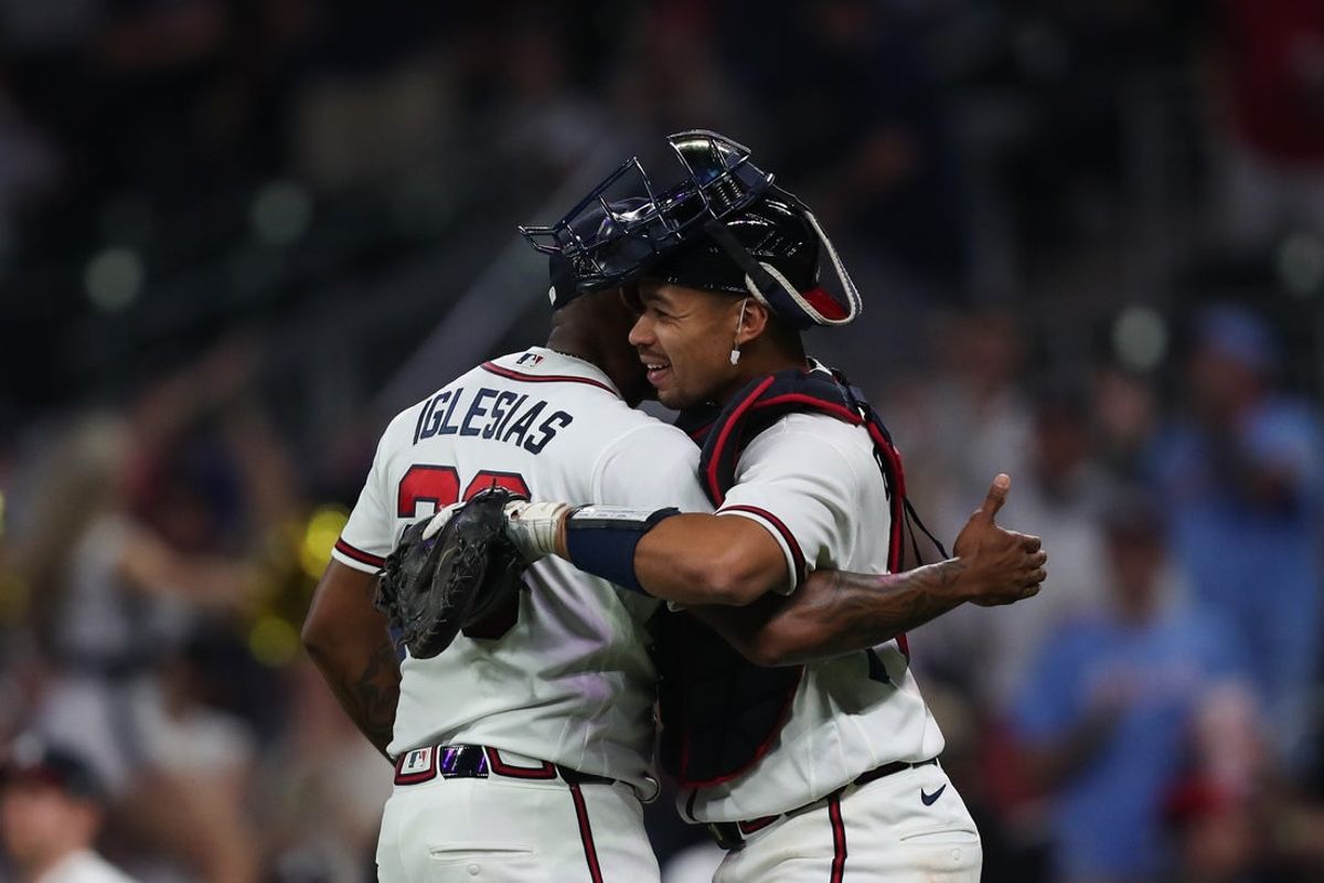 Apr 14, 2026; Cumberland, Georgia, USA; Atlanta Braves pitcher Raisel Iglesias (26) and catcher Drake Baldwin (30) embrace after a victory over the Miami Marlins at Truist Park. Mandatory Credit: Mady Mertens-Imagn Images
