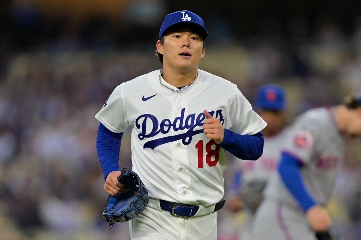 Apr 14, 2026; Los Angeles, California, USA; Los Angeles Dodgers pitcher Yoshinobu Yamamoto (18) runs off the mound after pitching against the New York Mets during the first inning at Dodger Stadium. Mandatory Credit: Jayne Kamin-Oncea-Imagn Images
