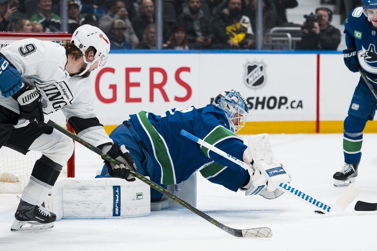 Apr 14, 2026; Vancouver, British Columbia, CAN; Los Angeles Kings forward Adrian Kempe (9) watches as Vancouver Canucks goalie Kevin Lankinen (32) reaches for the rebound in the first period at Rogers Arena. Mandatory Credit: Bob Frid-Imagn Images