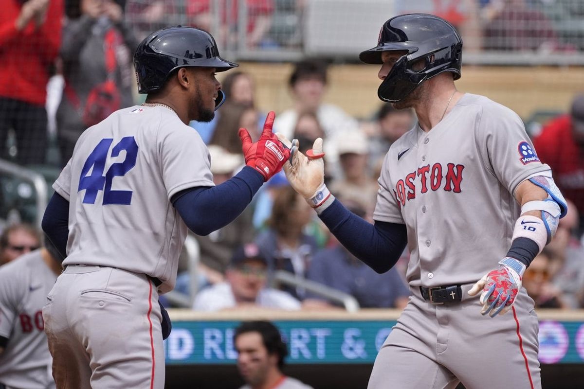 Apr 15, 2026; Minneapolis, Minnesota, USA; Boston Red Sox shortstop Trevor Story (right) celebrates his three run home run against the Minnesota Twins with center fielder Ceddanne Rafaela in the third inning at Target Field. Mandatory Credit: Bruce Kluckhohn-Imagn Images