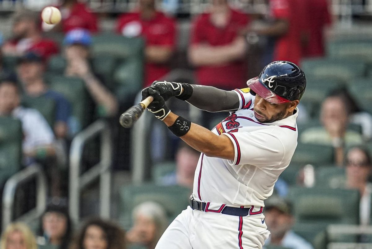 Apr 15, 2026; Cumberland, Georgia, USA; Atlanta Braves designated hitter Dominic Smith (8) hits a single against the Miami Marlins during the second inning at Truist Park. All players are wearing number 42 today in honor of Jackie Robinson. Mandatory Credit: Dale Zanine-Imagn Images