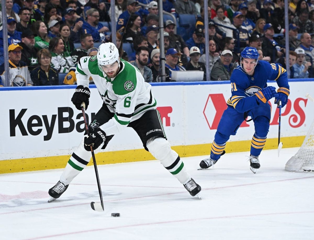 Apr 15, 2026; Buffalo, New York, USA; Dallas Stars defenseman Lian Bichsel (6) handles the puck in front of Buffalo Sabres right wing Josh Doan (91) in the second period at KeyBank Center. Mandatory Credit: Mark Konezny-Imagn Images