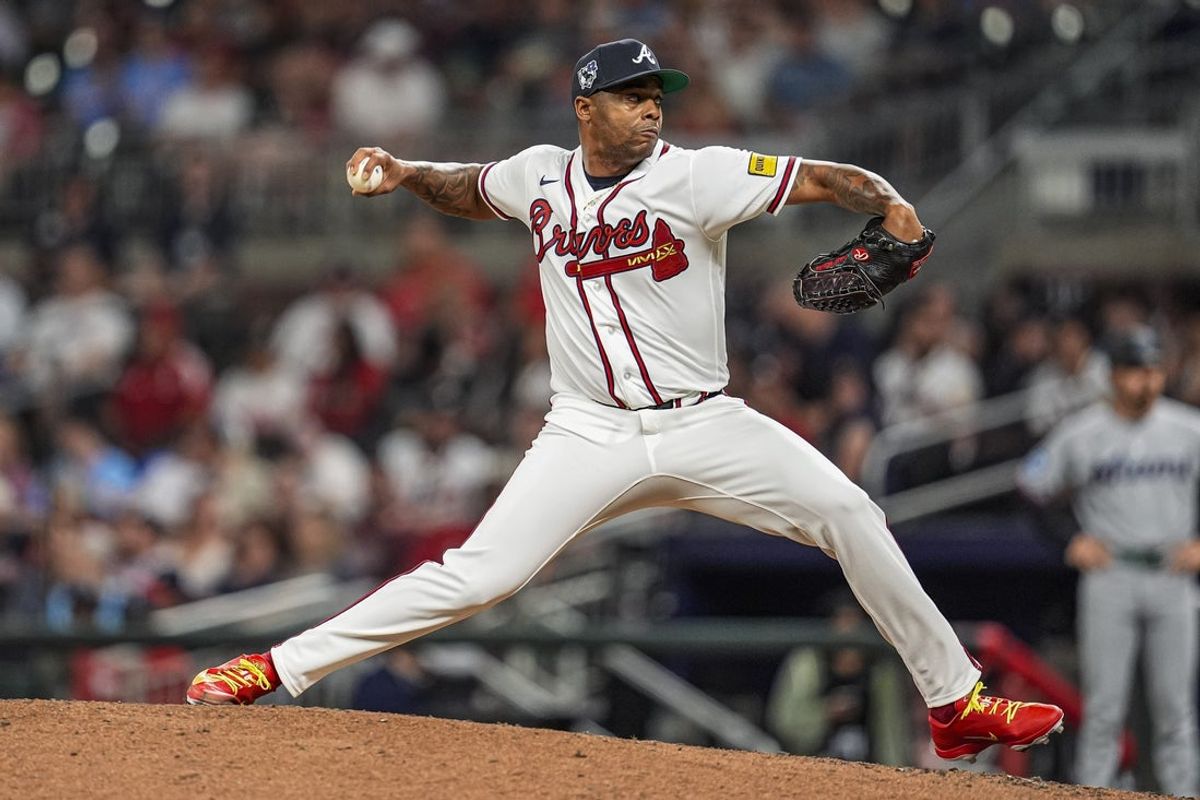 Apr 15, 2026; Cumberland, Georgia, USA; Atlanta Braves pitcher Raisel Iglesias (26) pitches against the Miami Marlins during the ninth inning at Truist Park. All players are wearing number 42 today in honor of Jackie Robinson. Mandatory Credit: Dale Zanine-Imagn Images