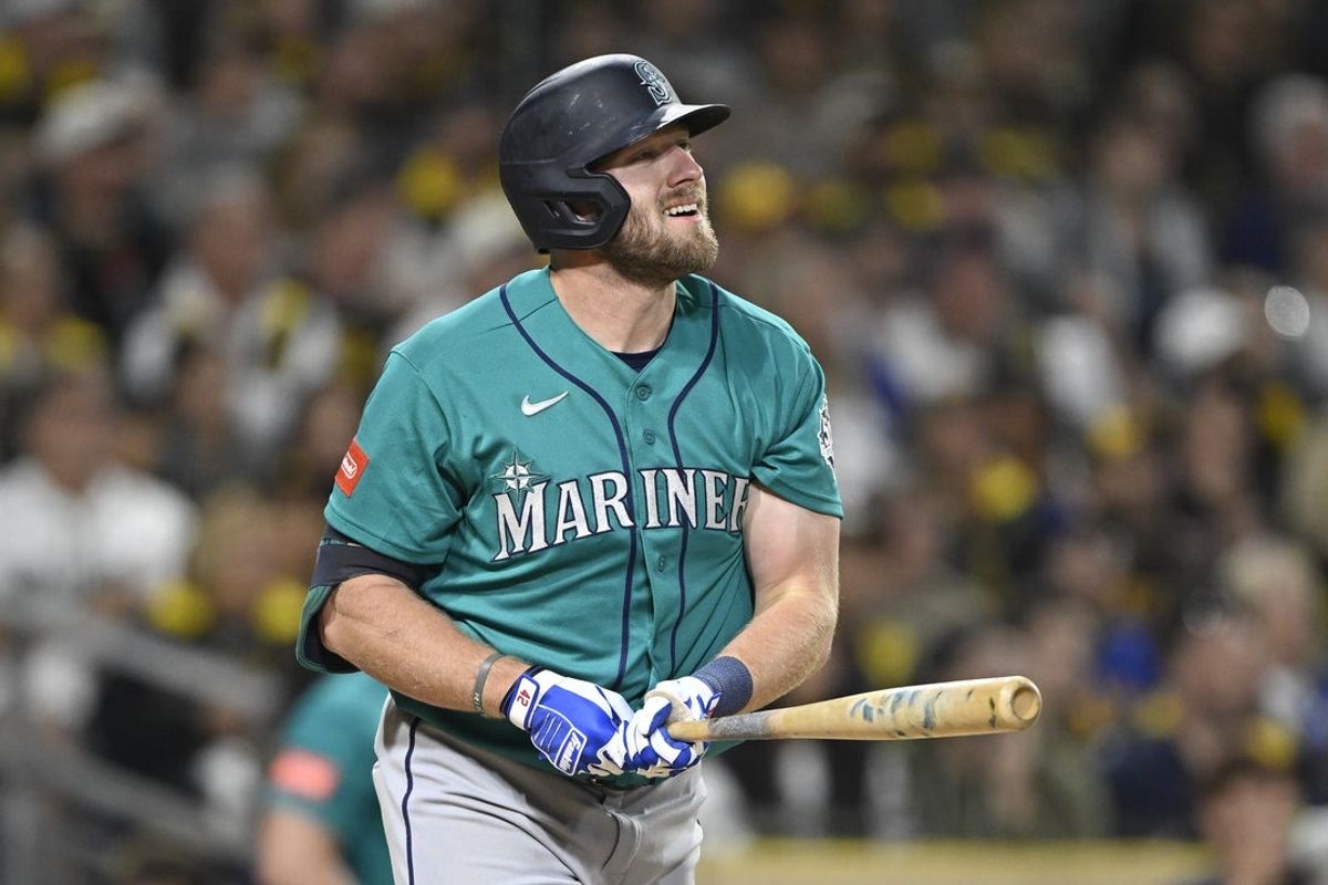 Apr 15, 2026; San Diego, California, USA; Seattle Mariners right fielder Luke Raley hits a two-run home run during the fifth inning against the San Diego Padres at Petco Park. All MLB players are wearing number 42 today to honor Jackie Robinson. Mandatory Credit: Denis Poroy-Imagn Images
